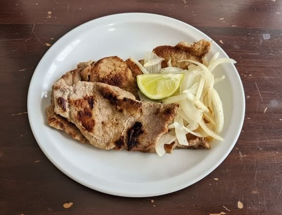 Bistec De Puerco / Grilled Pork Steak.